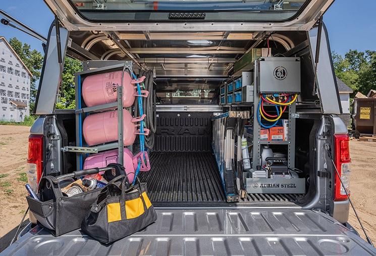 he interior of a pickup truck fully upfitted with Adrian Steel truck accessories