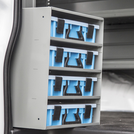 four Adrian Steel portable part cases stored in a storage cabinet specially designed for storing these cases