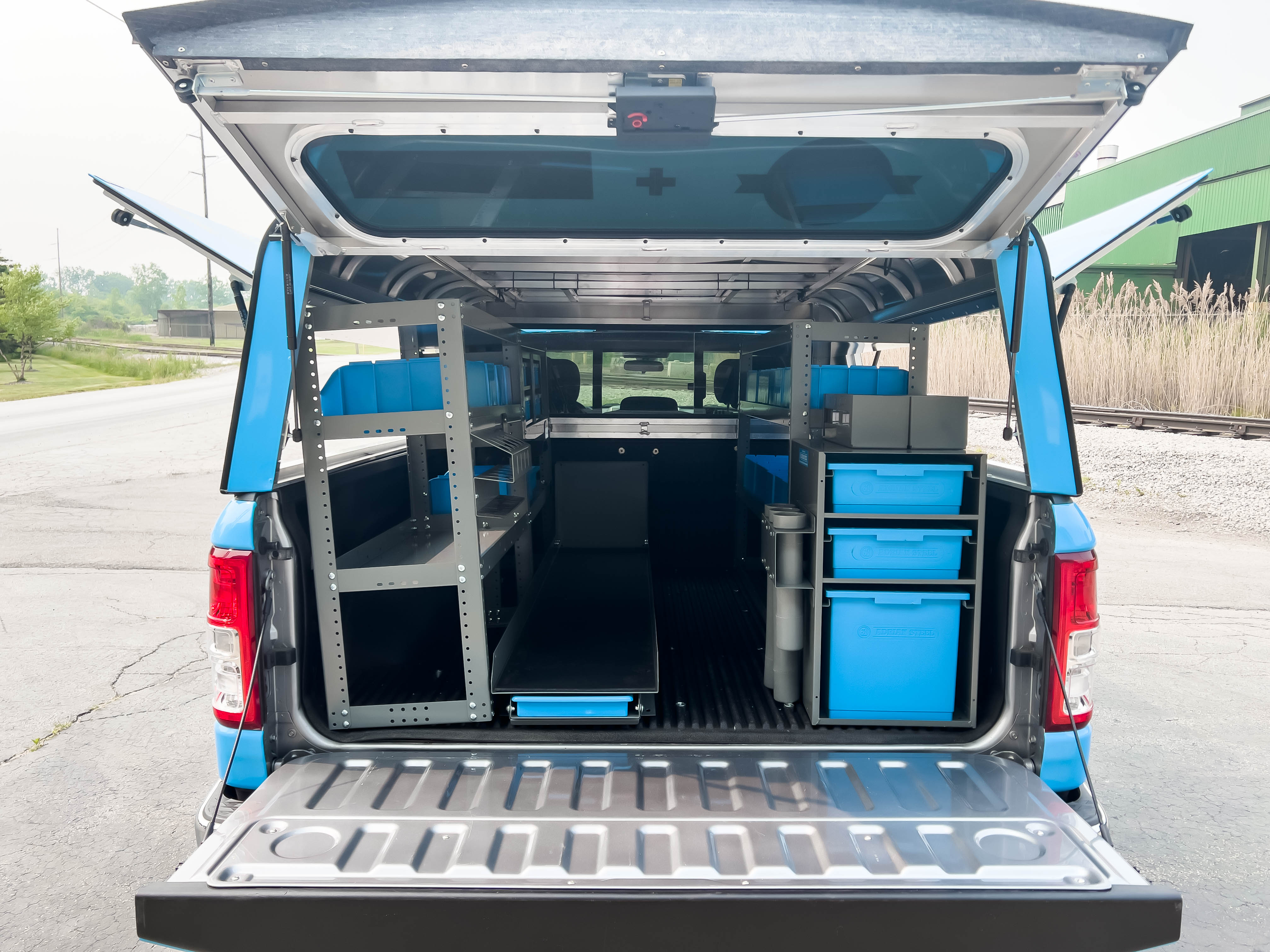 rear view of a pickup upfitted with an Adrian Steel Security Contractor truck storage package