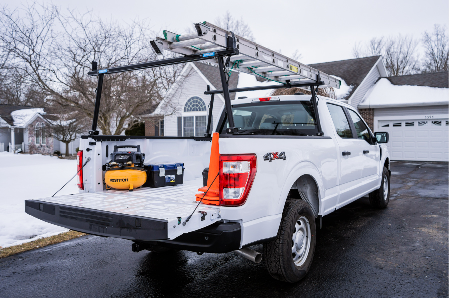  white pickup upfitted with an Adrian Steel pickup truck ladder rack known as the PROFILE™ - HD UTILITY RACK